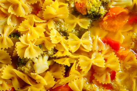 Farfalle pasta with stewed vegetables and spices.close-up. horizontal photoの写真素材
