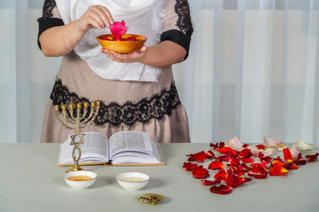 A Jewish woman performs superstition conspiracies before the wedding with rose petals to be the most...