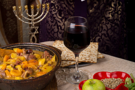 A woman at the table set for the Passover Seder. horizontal photoの写真素材
