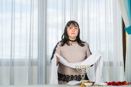 Before the wedding, a Jewish woman holds a white handkerchief in her hands, reading blessings on family life telilim. horizontal photoの写真素材