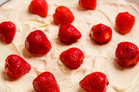 Fresh juicy red strawberries in whipped cream close-up. horizontal photoの写真素材