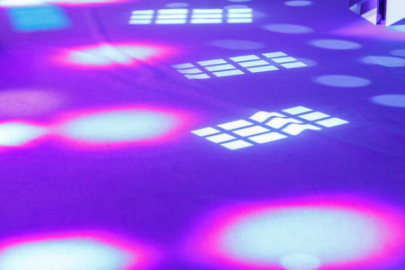 rays of colored light in the smoke from lighting fixtures on the surface on the floor demonstration. horizontal photoの写真素材