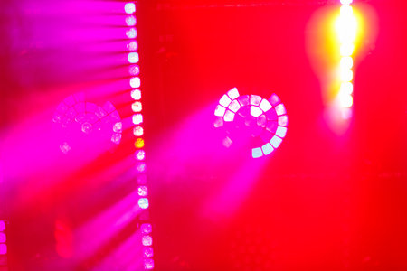Red and white light from lighting fixtures and heavy smoke demonstration. Horizontal photo.の写真素材
