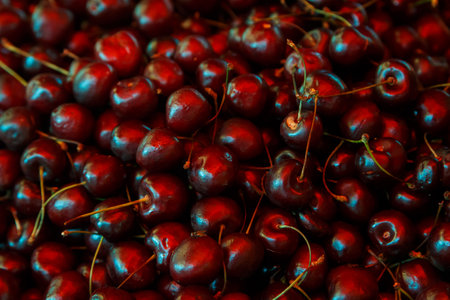 Fresh and fragrant cherries are a large scattering on the market counter. horizontal photoの写真素材