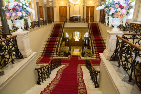 June 24, 2023 Russia, St. Petersburg, Nicholas Palace, staircase with a red carpetのeditorial素材