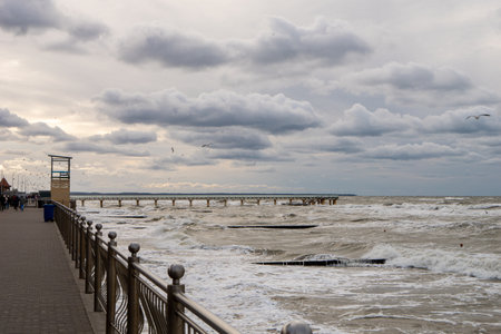 October 7, Russia, Zelengradsk, seashore embankment on a cloudy day, strong storm waves. Horizontal photo.の写真素材