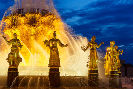 September 20, 2023 Russia, Moscow, Fountain of Friendship of Peoples with gilded sculptures of representatives of the peoples of Russia in the evening with illuminationのeditorial素材