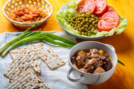 Lamb stewed with potatoes in spices and sauce next to dried fruits and vegetables flatbread iftar...