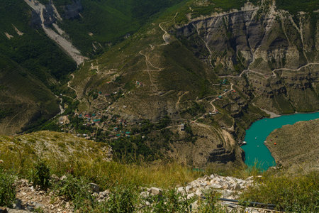A deep canyon, a view from the mountains to a winding river with azure water. horizontal photoの写真素材