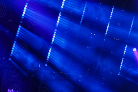 Blue light and white cold rays are narrow from the lighting fixtures of the guns demonstration. Horizontal photo.の写真素材