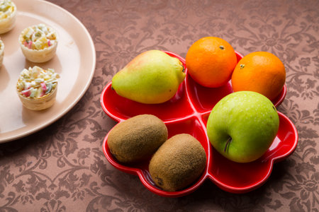 on the table there is salad in tartlets, fruit snacks. horizontal photoの写真素材