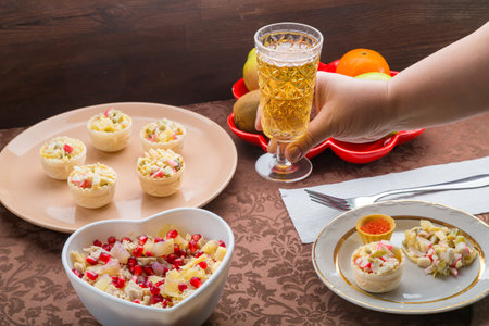 Sparkling champagne in two glasses on a festively set table. horizontal photoの写真素材
