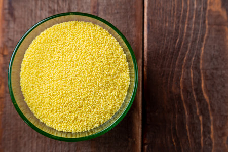 crumbly couscous cereal in a glass bowl on the table Horizontal photoの写真素材