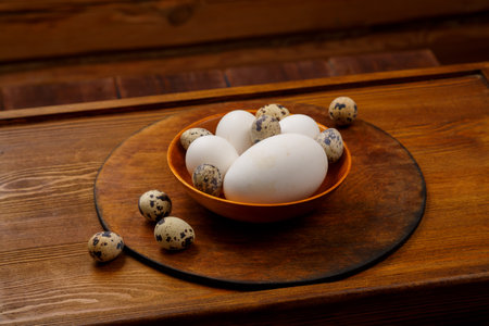 goose chicken and quail egg on a wooden table. Horizontal photo.の写真素材