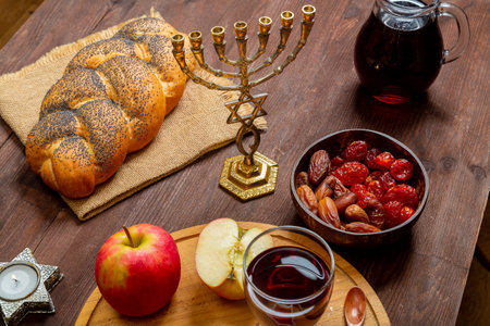 Challah, honey, apple and pomegranate and wine for the Rosh Hashanah holiday. Horizontal photo.の写真素材