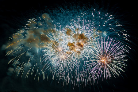 Multicolored figures silver and blue bright sparks of fireworksの写真素材