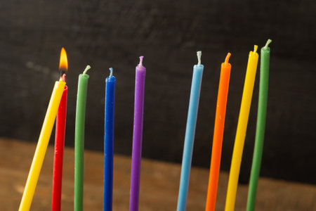 Colored candles on the holiday of Hanukkah are lit with a shamash. Horizontal photo.の写真素材