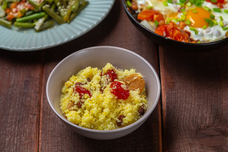 with traditional Jewish dishes for the holiday on the table chelnt couscous tzimmes. Horizontal photo.の写真素材