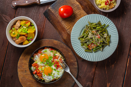 Set table, Jewish food, shakshuka and couscous with dried fruits. Horizontal photo.の写真素材