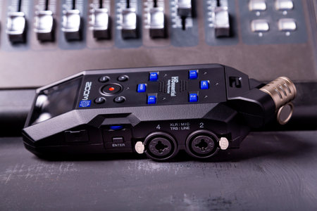 illustrative editorial materials, zoom h6 essential sound recorder on a gray background at the sound consoleの写真素材