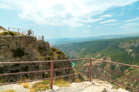 Mountain cliff fenced off for safety purposes. Horizontal photo.の写真素材