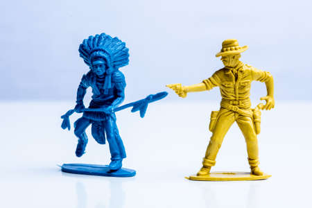 Blue indian and yellow cowboy plastic toy figures.の写真素材