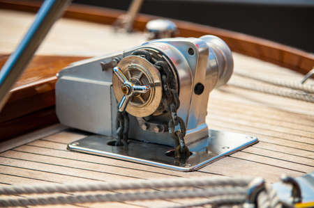 The anchor winch of a hand made wooden boat.の写真素材