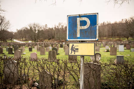 Parking sign at a graveyard warning for thieves.の写真素材