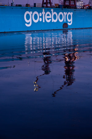 Gothenburg, Sweden January 21 2011: The reflections of the cranes on the dock of the former Götaverken Cityvarvet in Gothenburg, Sweden a beautiful winter afternoon.のeditorial素材