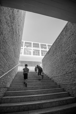 Lisboa, Portugal - July 22 2016: Two boys walking up stairs at Centro Cultural de Belem.のeditorial素材