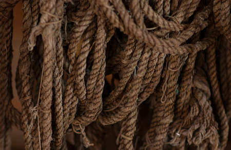 Old, brown ropes used for fishing nets.の写真素材