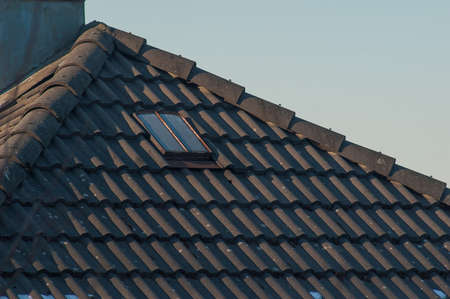 Roof window on an old building.の写真素材