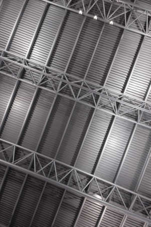 Metal roof of a large building seen from the inside.