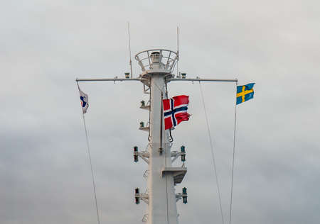 The sewdish and norwegian flag in a ship's mast.の写真素材
