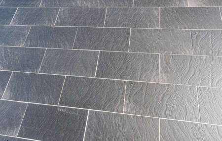 Slate stone flooring outside a house.