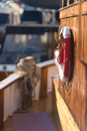 Bow ornament of a viking ship in front of a modern skyscraper skyline.の写真素材