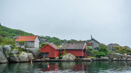 Holiday houses and boat houses on a small island.の写真素材