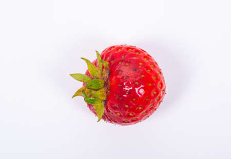 Closeup of a strawberry on white background.