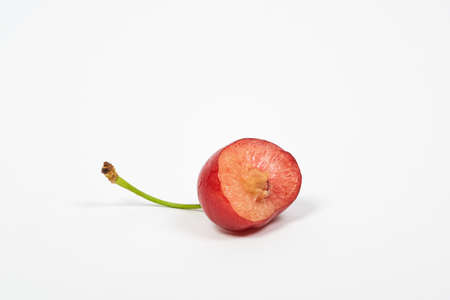 Half eaten sweet cherry, Prunus avium.の写真素材