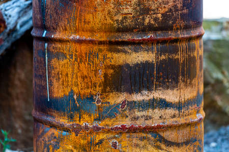Oxidiced side of a burnt out metal barrel.の写真素材