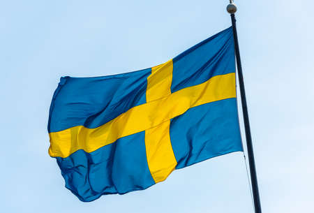 Swedish flag waving in the breeze.の写真素材