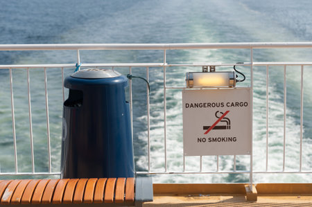 Hirtshals , Denmark - April 22 2011: Trash can and warning sign on aft deck of RoRo passenger ferry Color Line SuperSpeed 1 (IMO 9374519)のeditorial素材