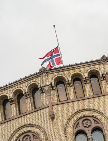 Oslo, Norway - July 24 2011: Flag flying at half-staff at the Parliament of Norway Building, Stortinget.のeditorial素材