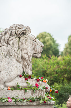 Oslo, Norway - July 22 2012: Roses on a lion statue at the parliament building in Oslo.のeditorial素材