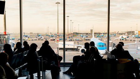 Schiphol , Netherlands - February 13 2013: People waiting for flights at Schiphol terminal B.のeditorial素材