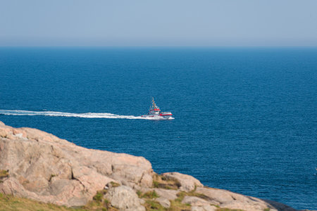 Lindesnes, Norway - July 11 2014: SAR vessel RS 100 Ægir passing Lindesnes Fyr.のeditorial素材