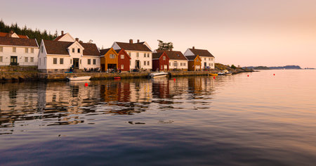 Lindesnes, Norway - July 11 2014: Holiday houses at Underøy at sunset.のeditorial素材