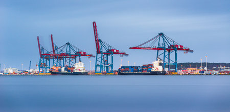 Gothenburg , Sweden - November 8 2013: Container ships loading at Skandiahamnen.のeditorial素材