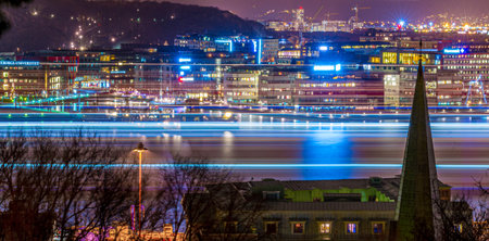 Gothenburg, Sweden  december 29 2013: Long exposure night image of a ship passing Lindholmen.のeditorial素材