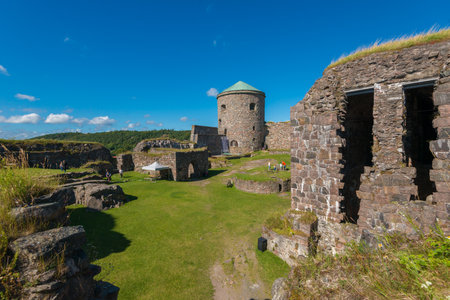 Kungalv , Sweden - August 8 2015: View of the inner bailey of Bohus fortress. The tower Fars Hatt in the background.のeditorial素材